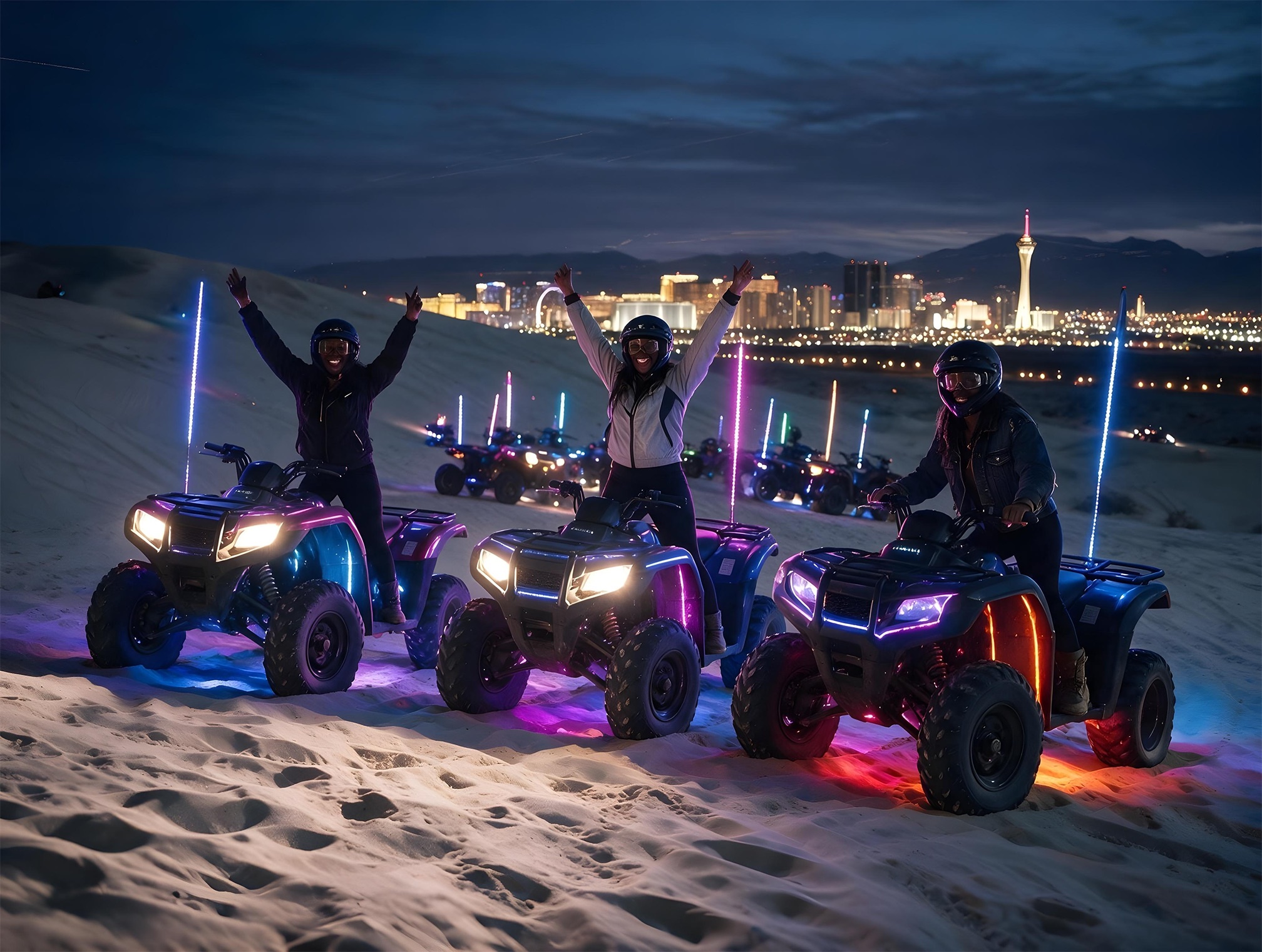 Riders celebrating on the dunes under a deep twilight sky